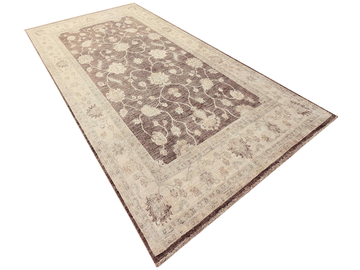 Beige and dark brown Afghan rug with repeating floral vine pattern and border