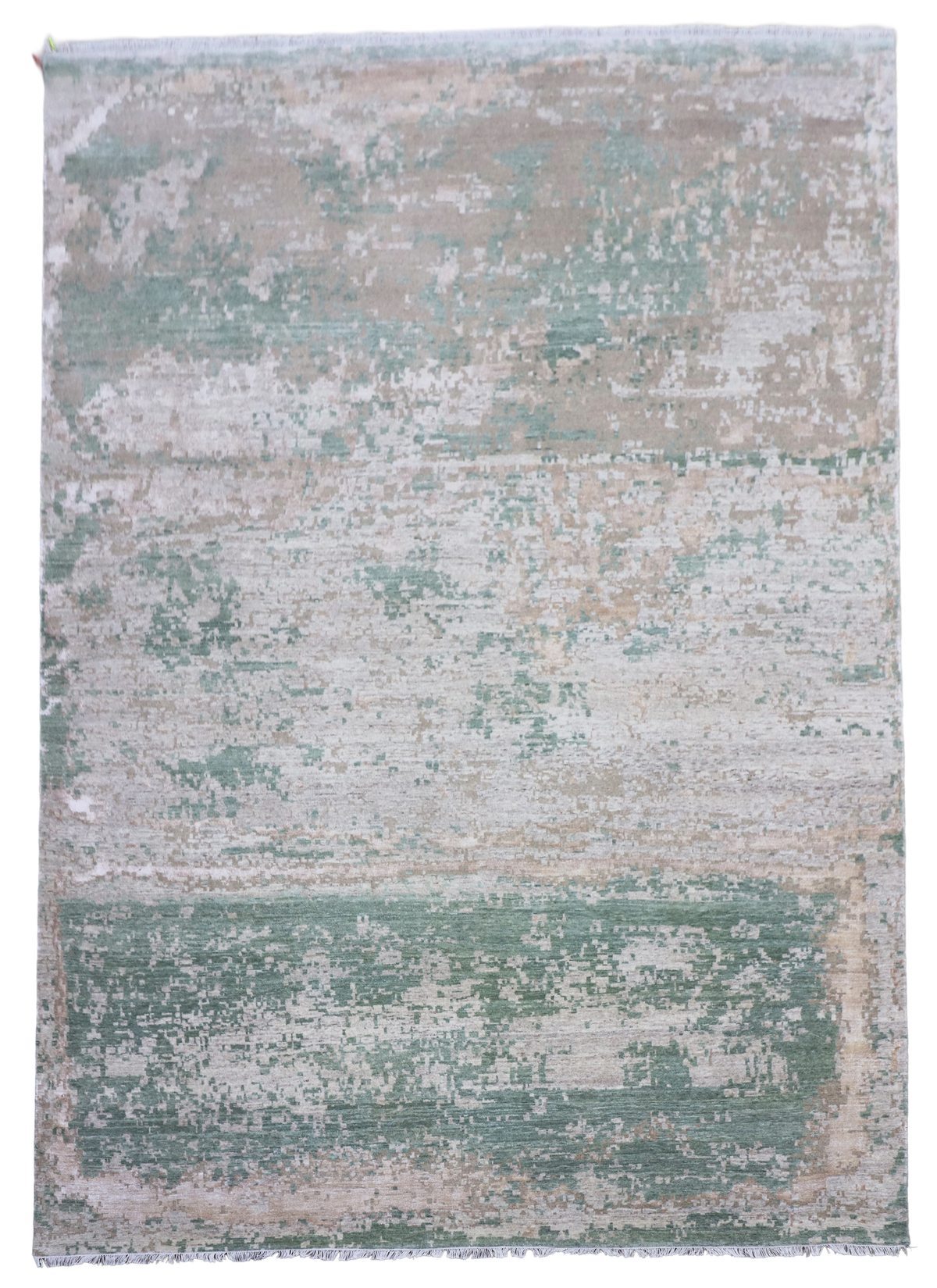 Rectangular modern abstract area rug in muted jade green, beige, and gray tones