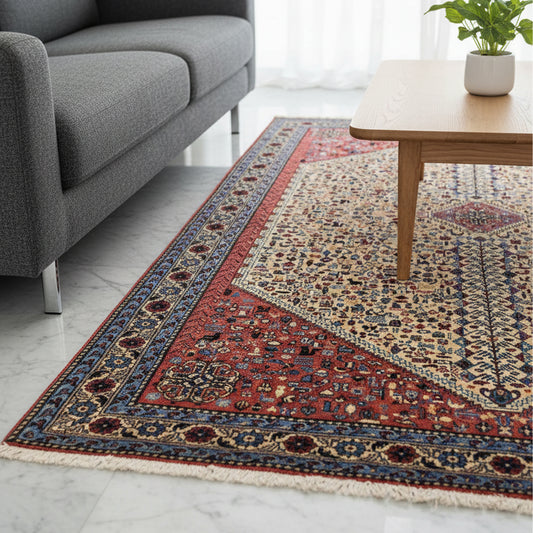200x300 cm rug on floor with red center band, cream field, blue border and short fringe