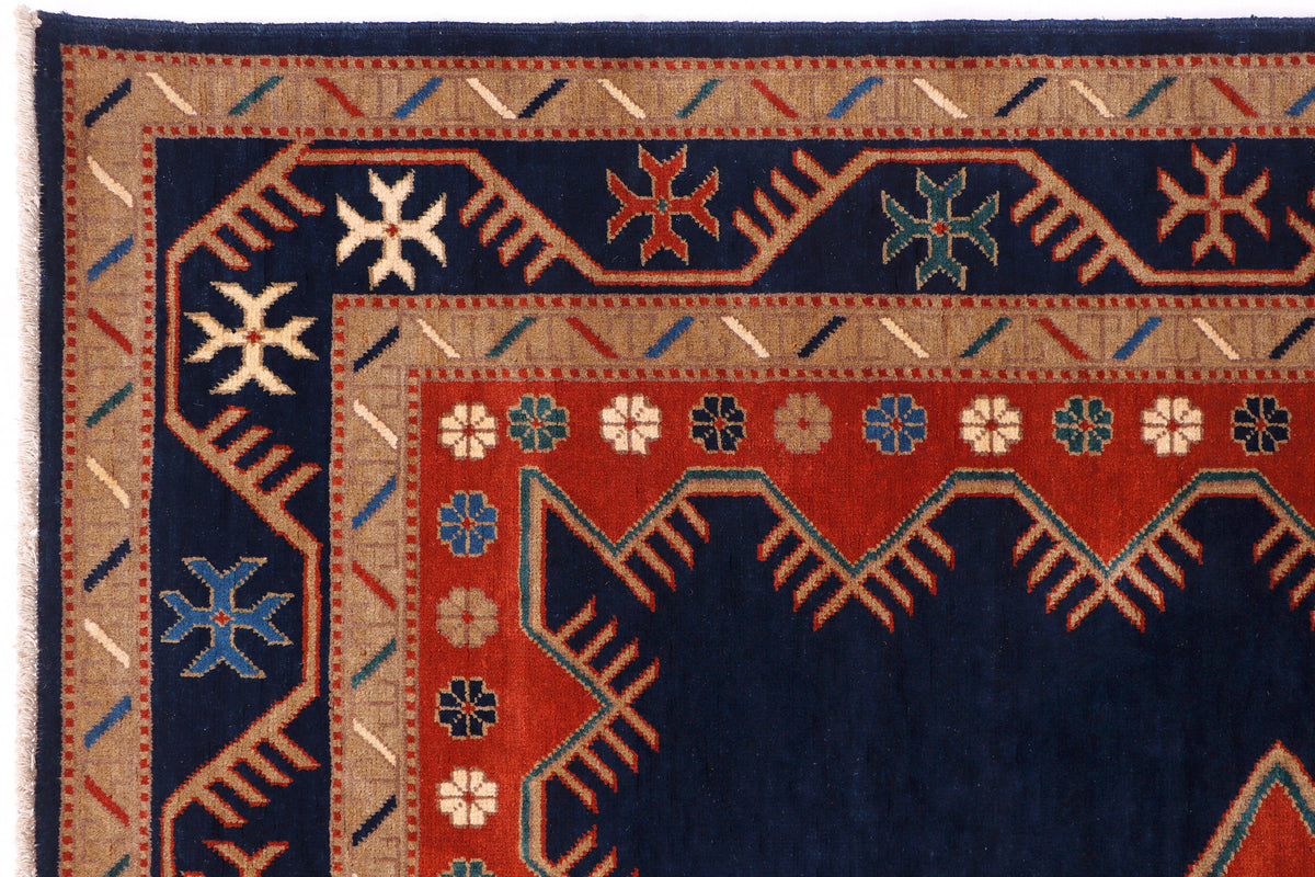 Close-up of blue and red geometric area rug border with diamond motifs.