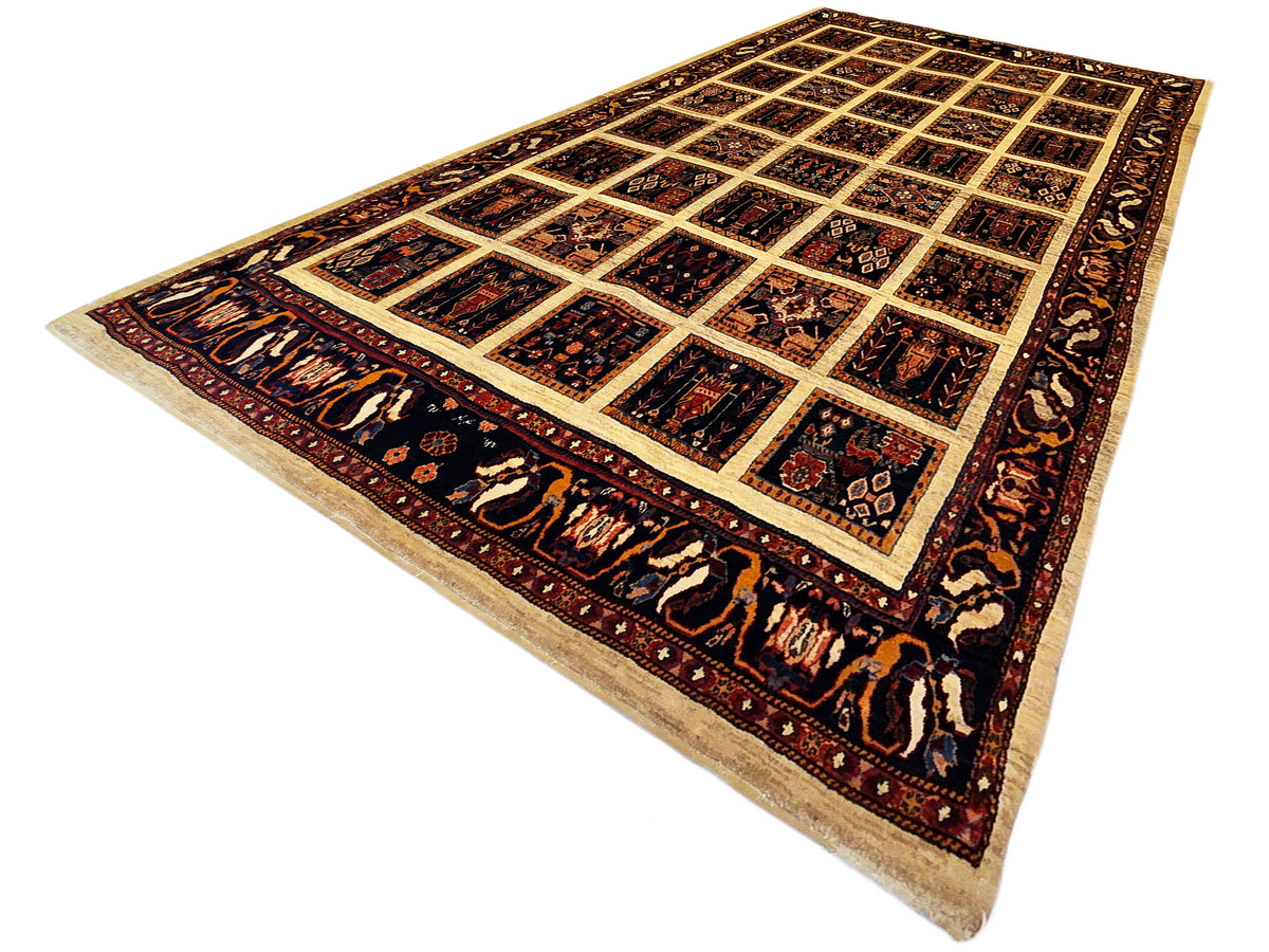 Loribaft rug, angled view, navy and rust panel grid with cream border