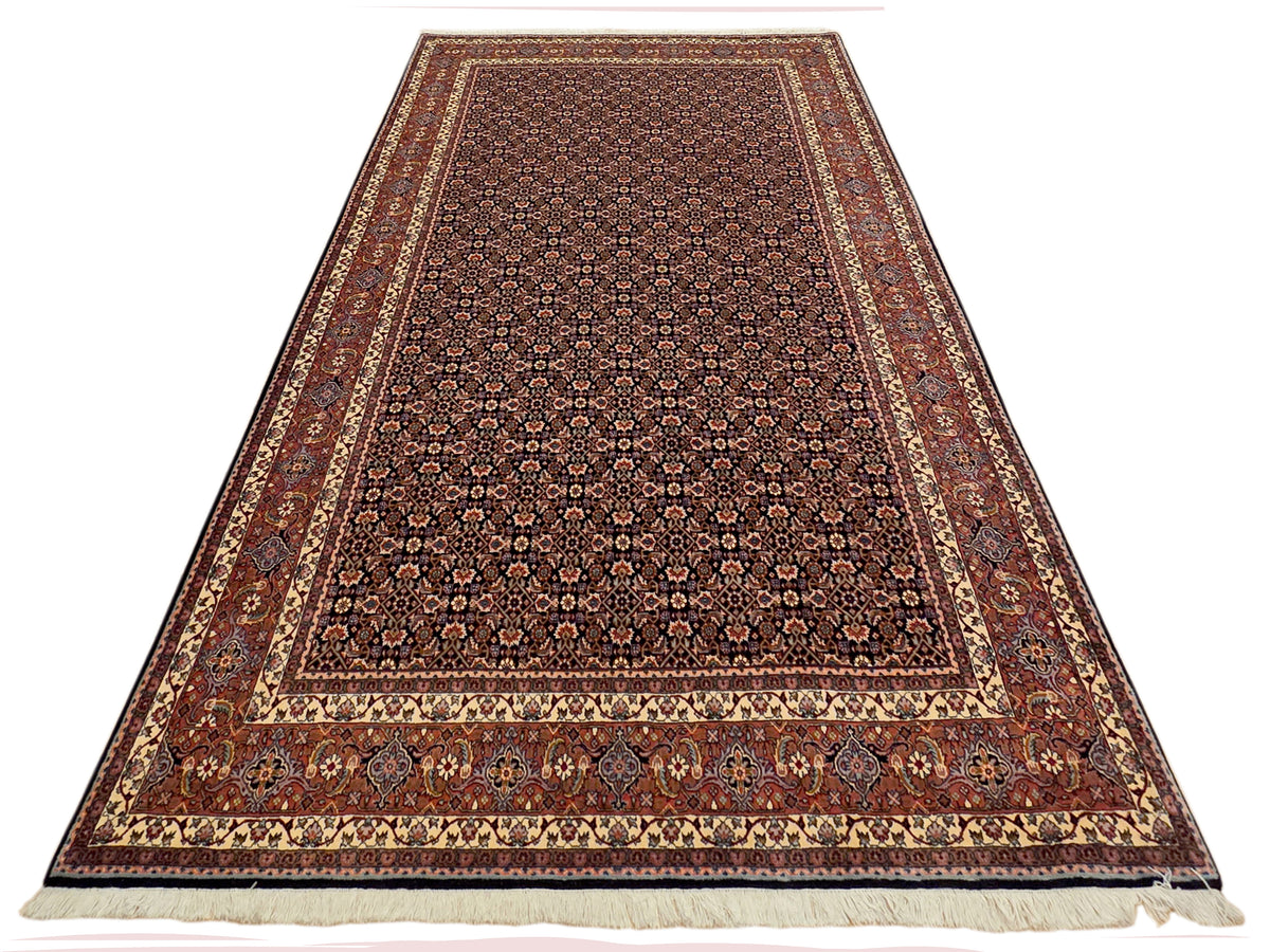 Flatweave rug with dense allover floral pattern in dark brown and rust tones