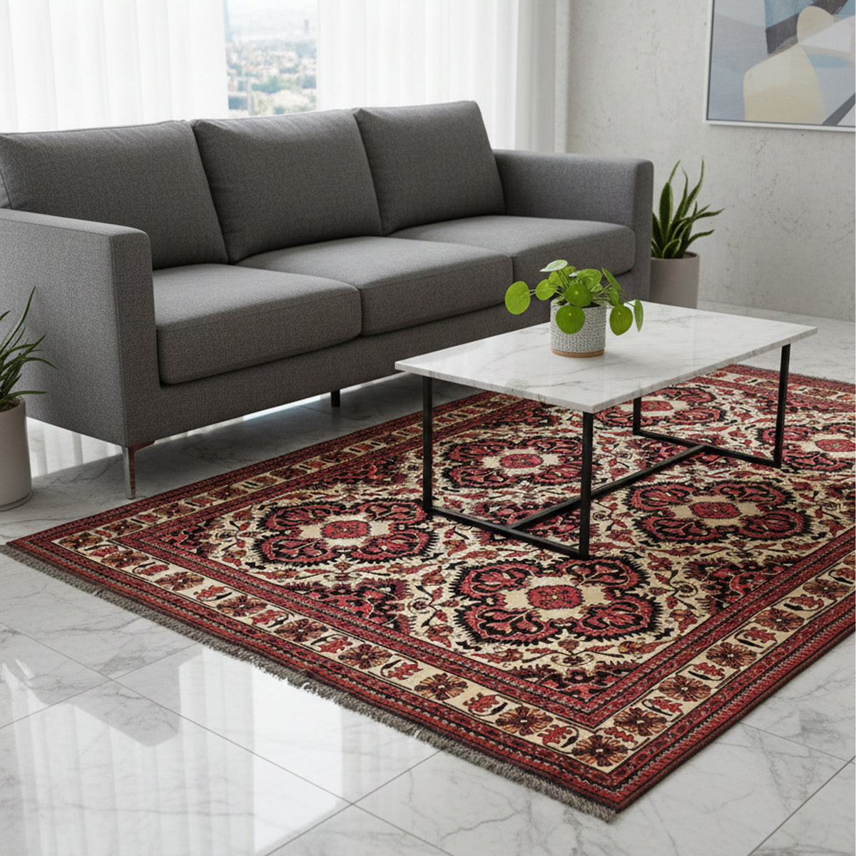 Afghan rug with cream, red, and dark geometric patterns placed on a living room floor.