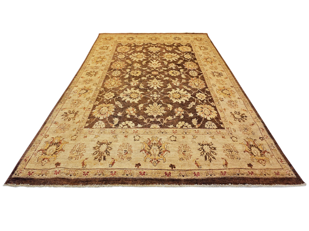 Rectangular rug with all-over floral and vine motifs in tan and dark brown; ornate border