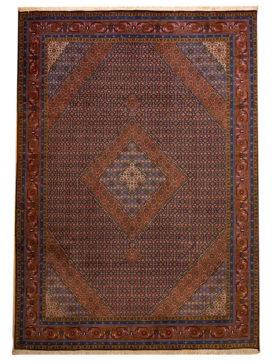 Large Persian-style area rug with dark red field, blue accents, and central medallion