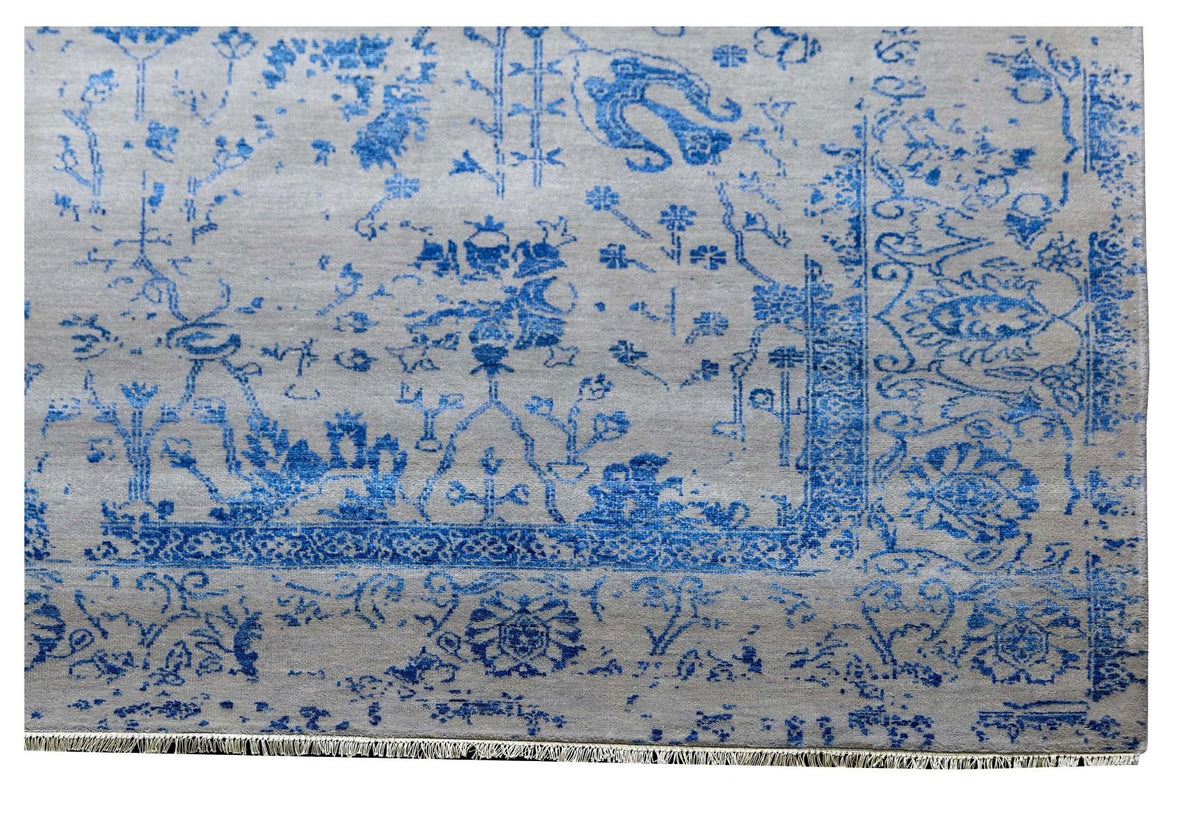 Blue and white patterned area rug, detailed central motif and border