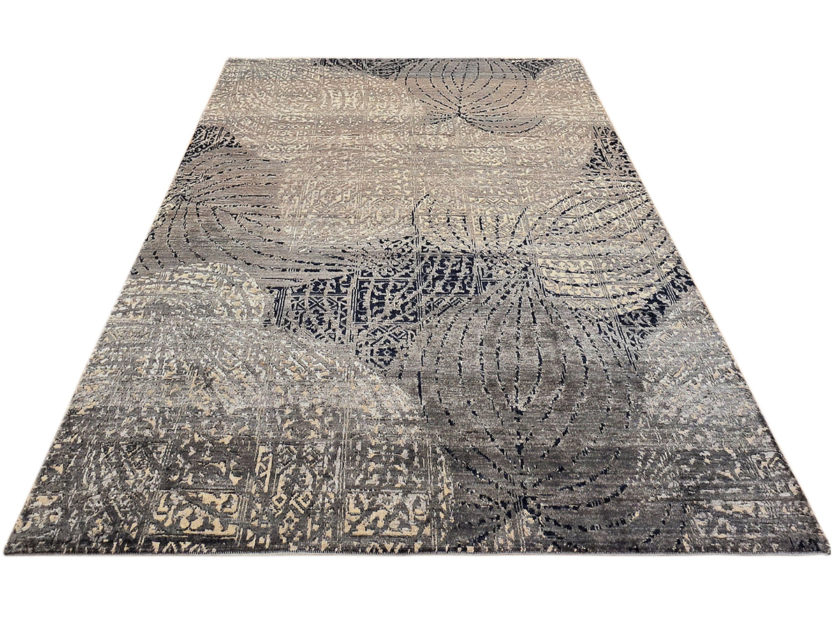 231x167 cm rug with beige ground and dark navy abstract circular pattern