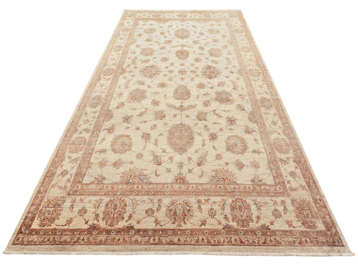 Cream rug with central round medallion, rust floral details, wide ornamental border.