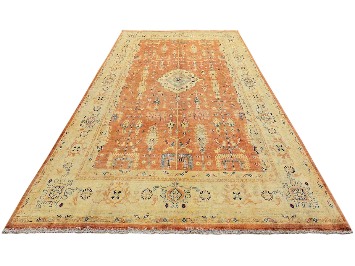 Large terracotta and cream rug with central medallion and decorative border