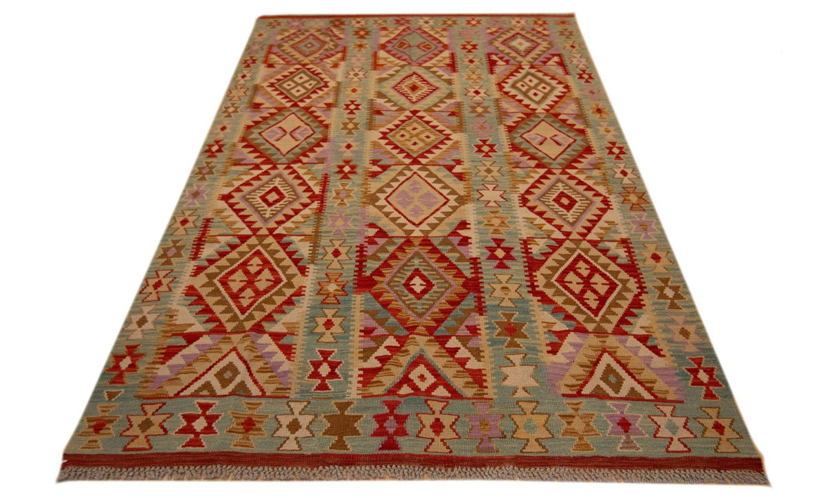 Multicolor kilim rug with red and tan geometric diamonds, zigzags, and patterned border