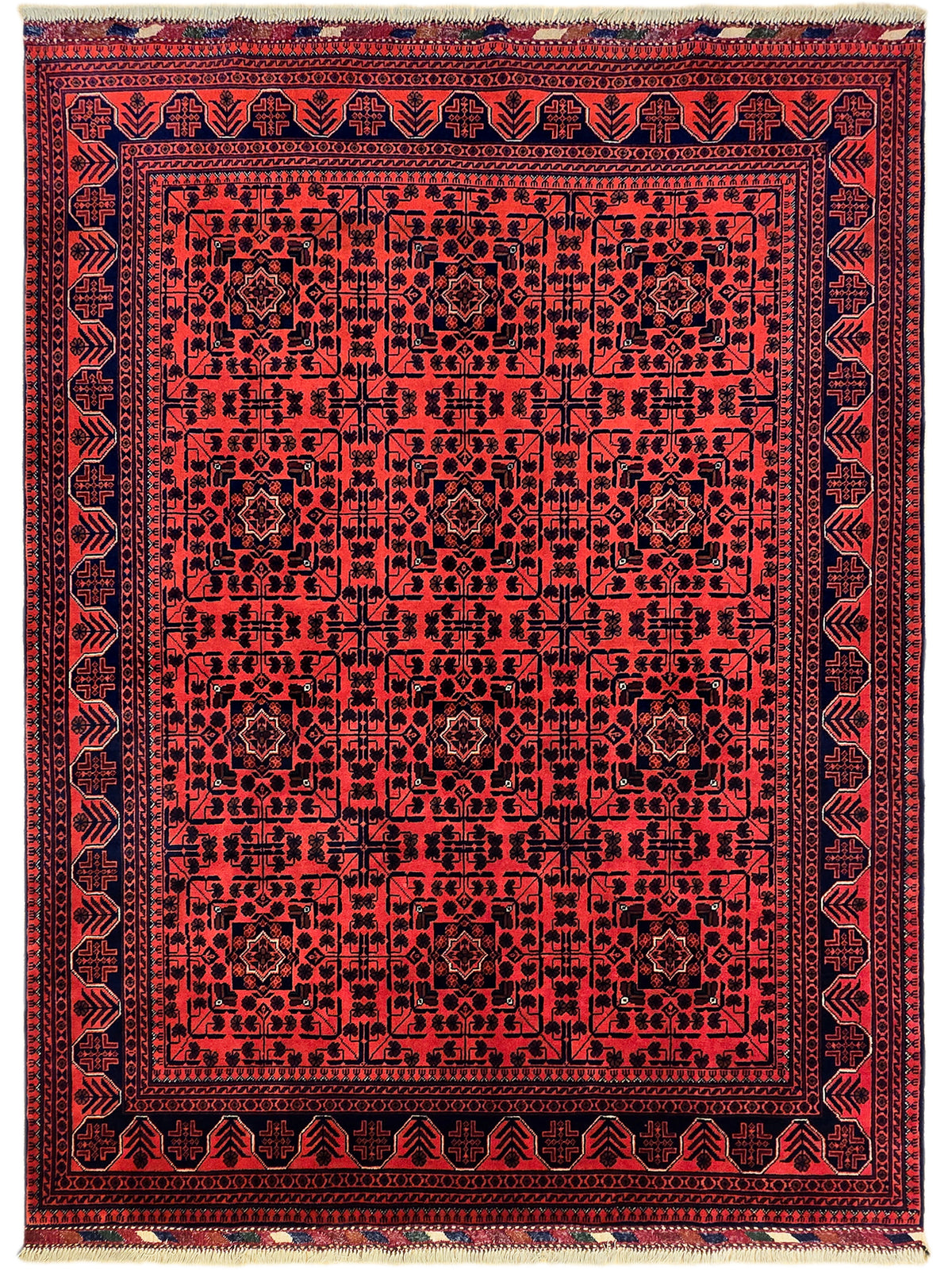 Red rug with dense navy medallion pattern and beige fringe border