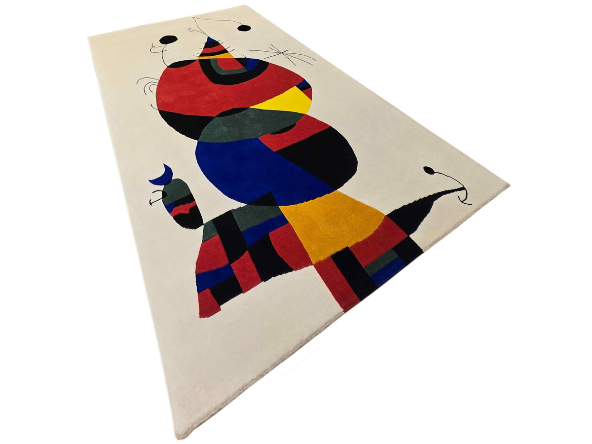 Abstract area rug with off-white background and multicolor stylized animal design