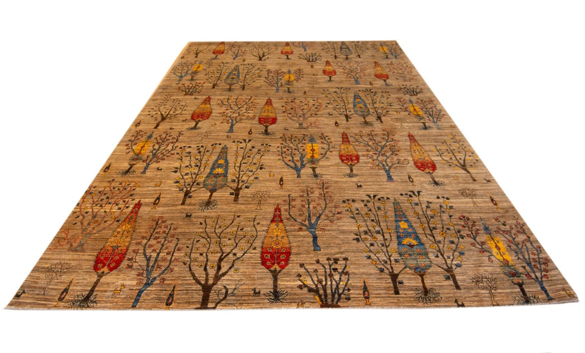 Rectangular tan rug with tree-and-lantern motif, red and blue accents