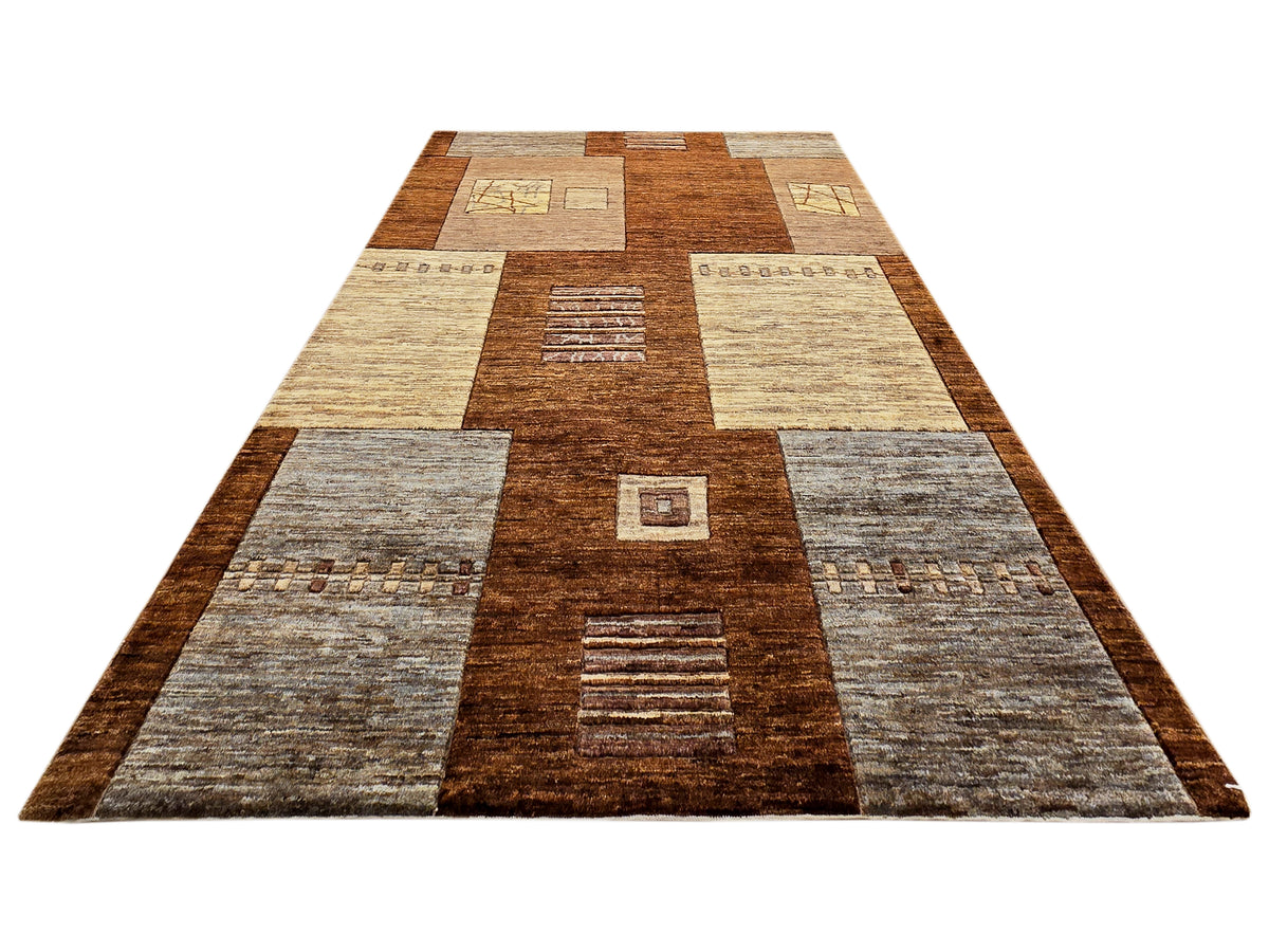 Patchwork area rug with central brown stripe, beige and gray square motifs