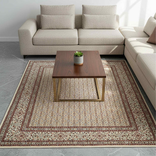 Persian area rug in living room setting, ivory base with rust red and patterned border
