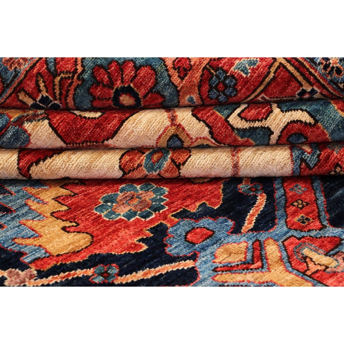 Chobi rug close-up of folded edge showing textured pile in red, navy and cream