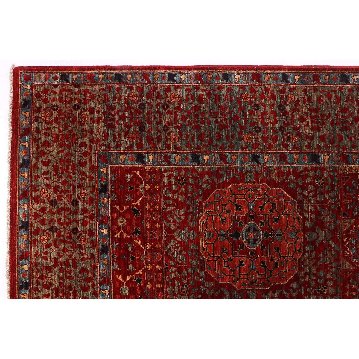 Mamluk rug close-up with red pattern, blue accents, and detailed border