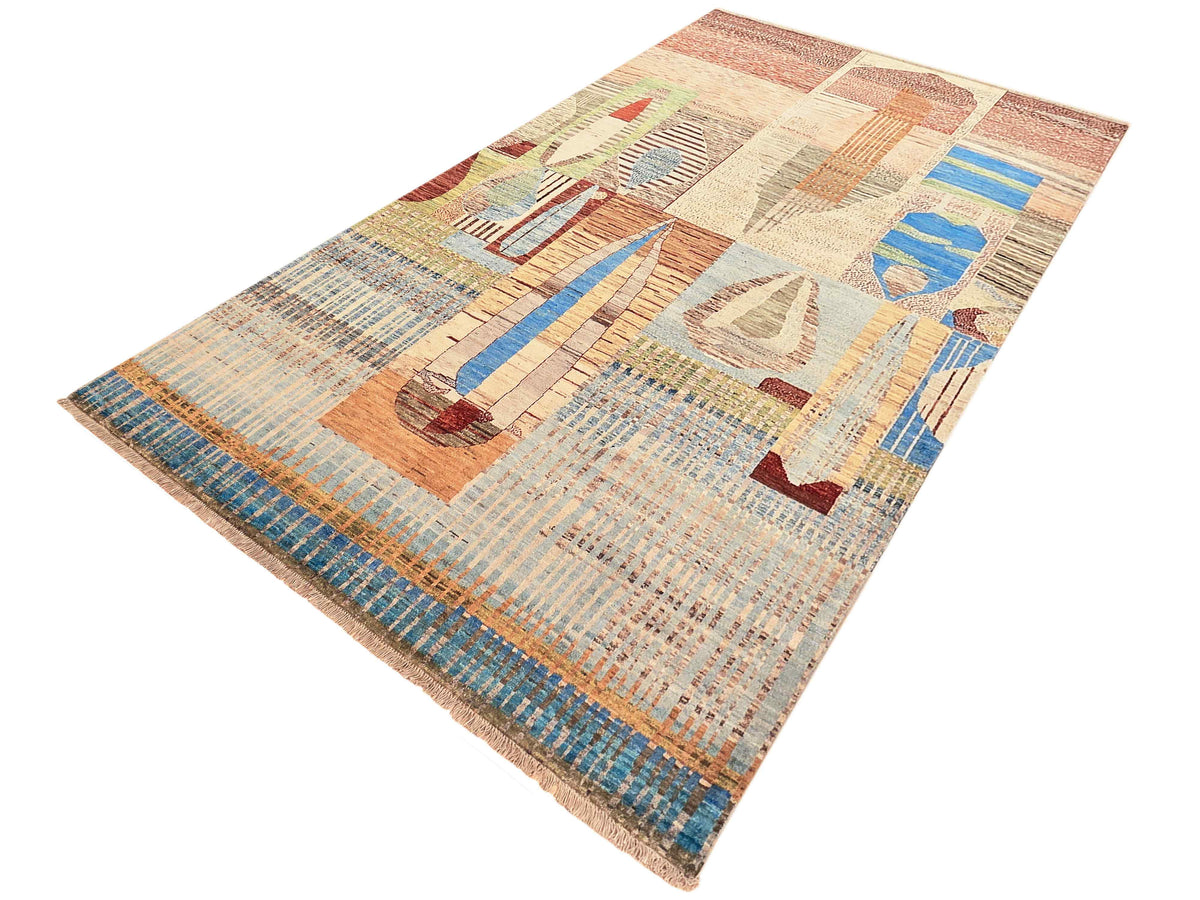Rectangular multicolor geometric area rug with abstract shapes and detailed textured weave.