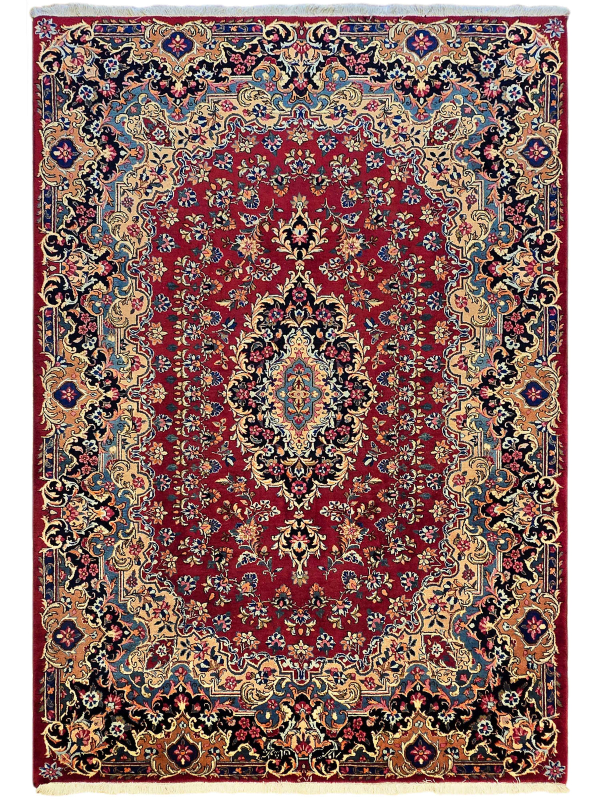 Ornate red area rug with central medallion, floral motifs, and multicolor border