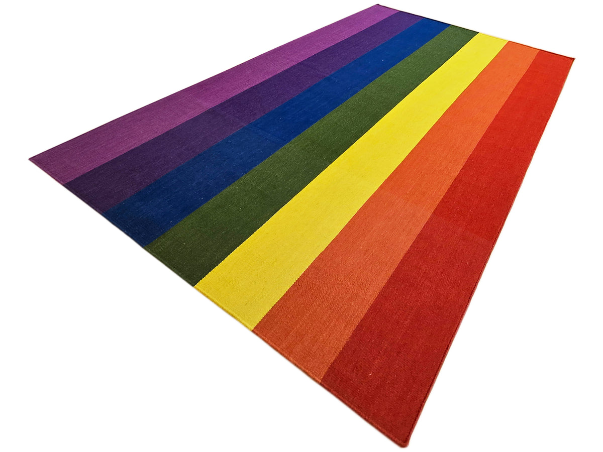 Multicolor striped rug with wide purple, blue, green, yellow, orange, and red bands