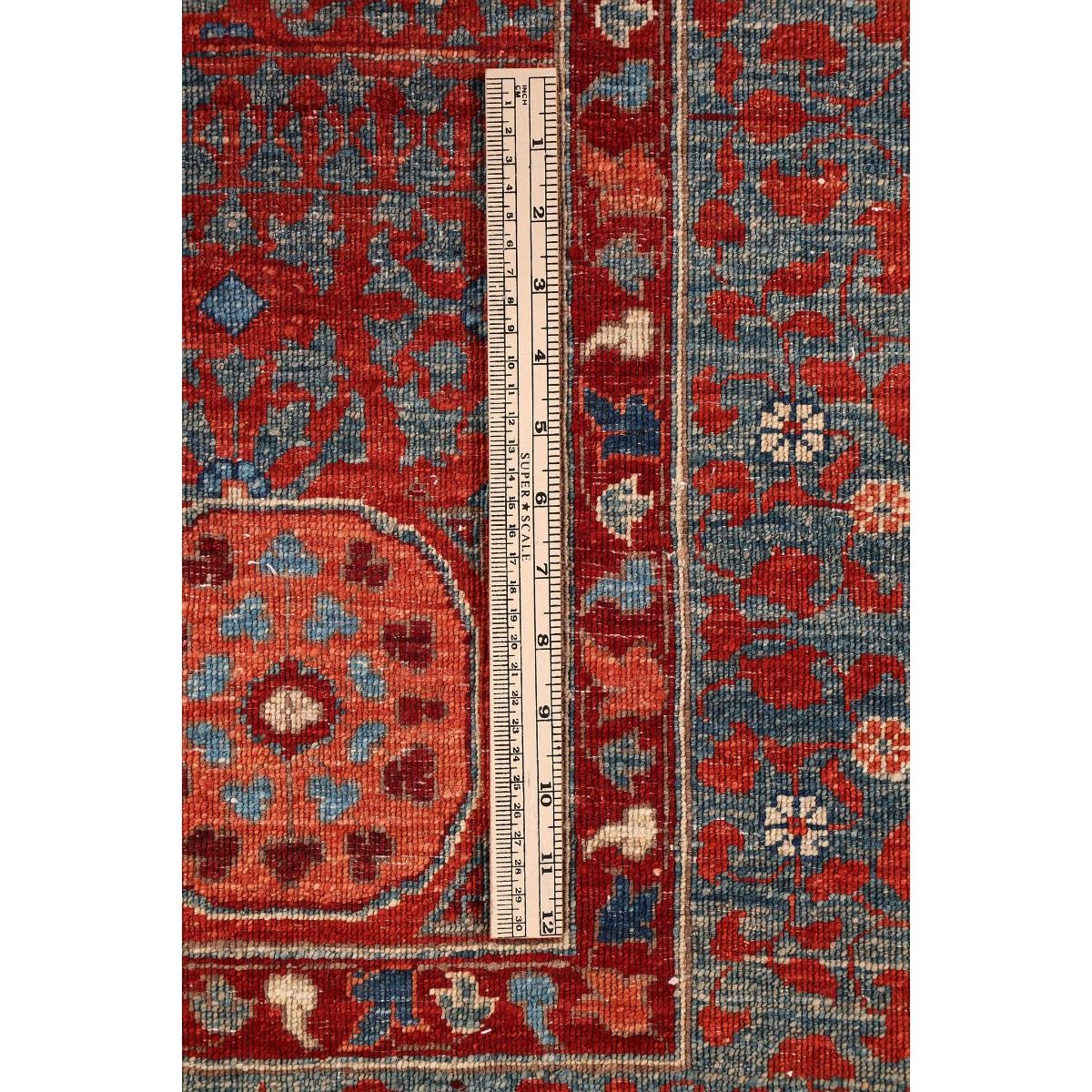 Mamluk rug close-up with red and blue floral and geometric patterning
