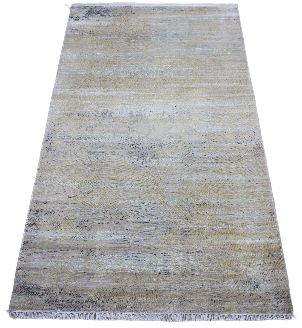 Rectangular modern area rug in light blue and cream with frayed short edges.