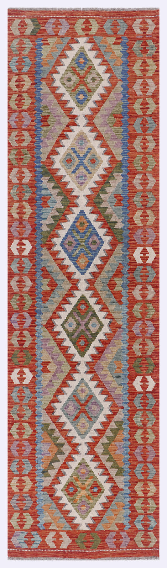 Kilim rug in orange with geometric diamond medallion pattern in blue, teal, and cream