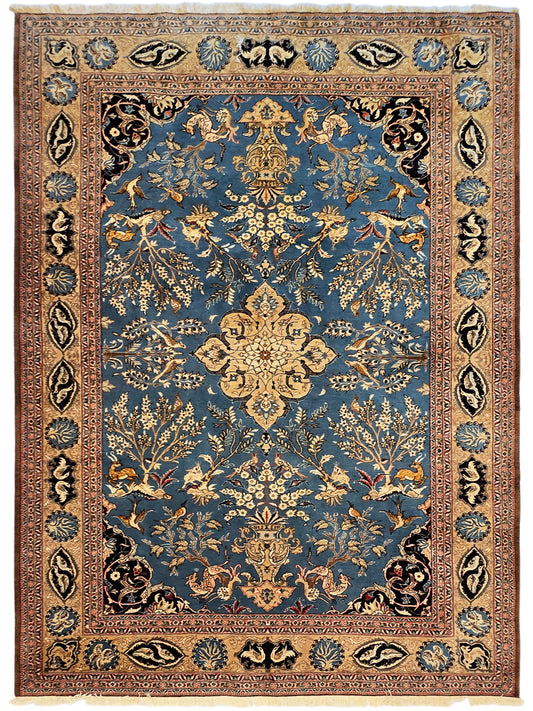Full view blue and brown ornate rug with central medallion and border