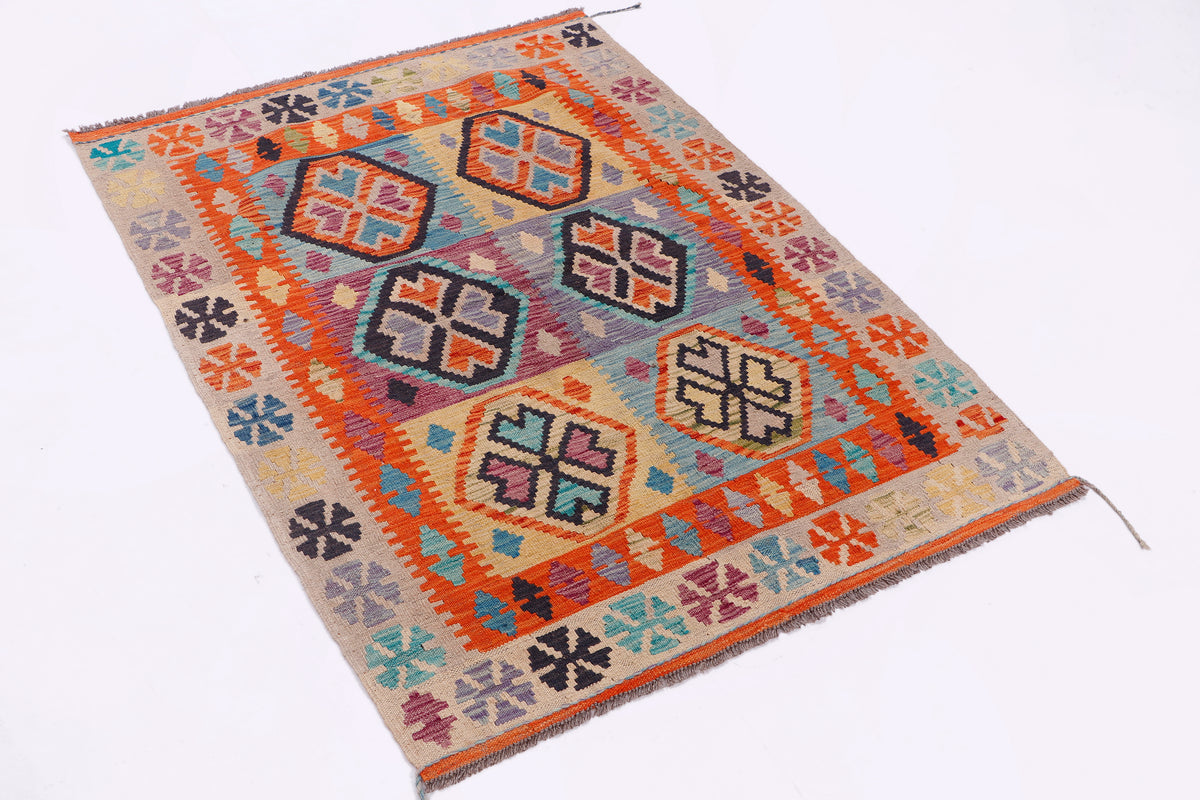Orange kilim rug with central medallion and multicolor geometric border, flatweave