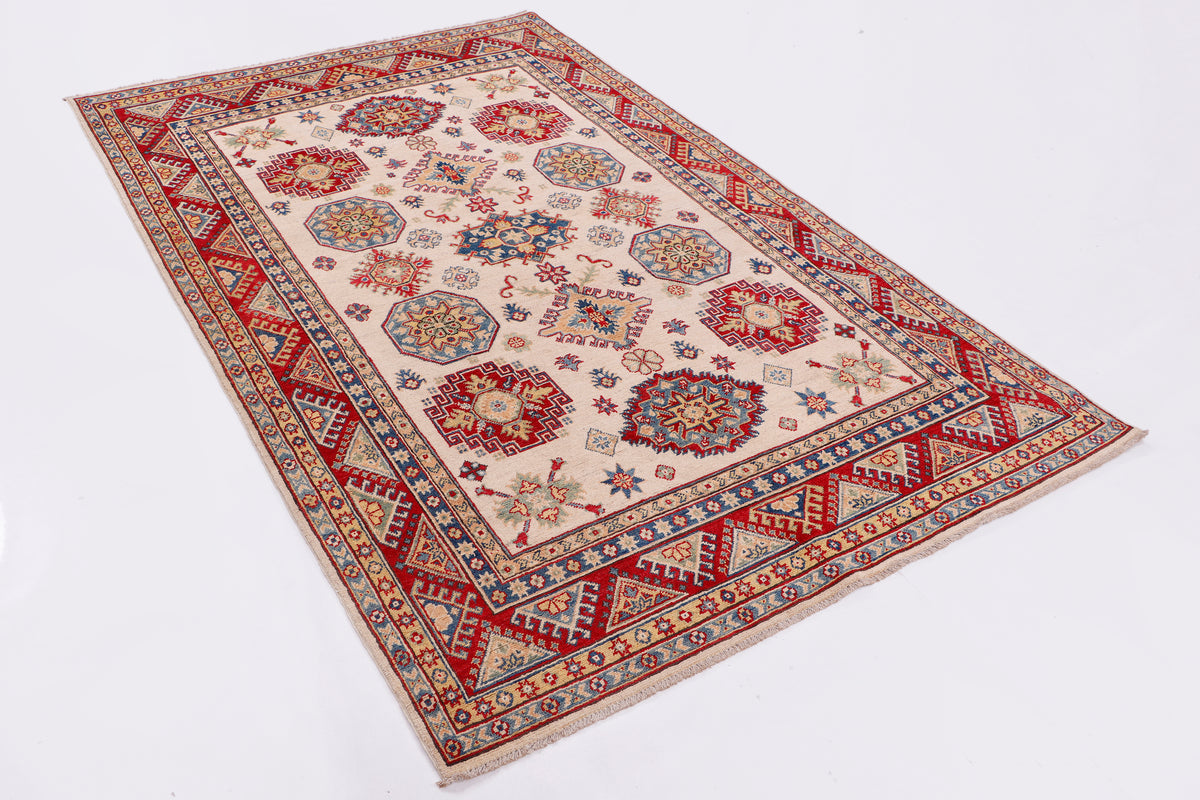 Red border Persian-style area rug with cream field and blue motif medallions
