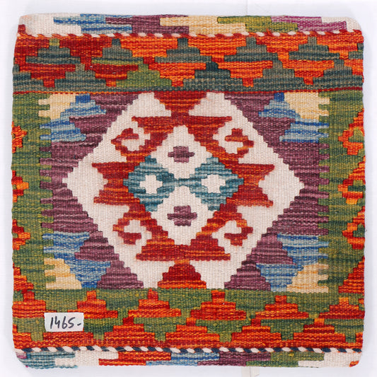 Square kilim cushion with geometric diamond motif in orange, green, blue