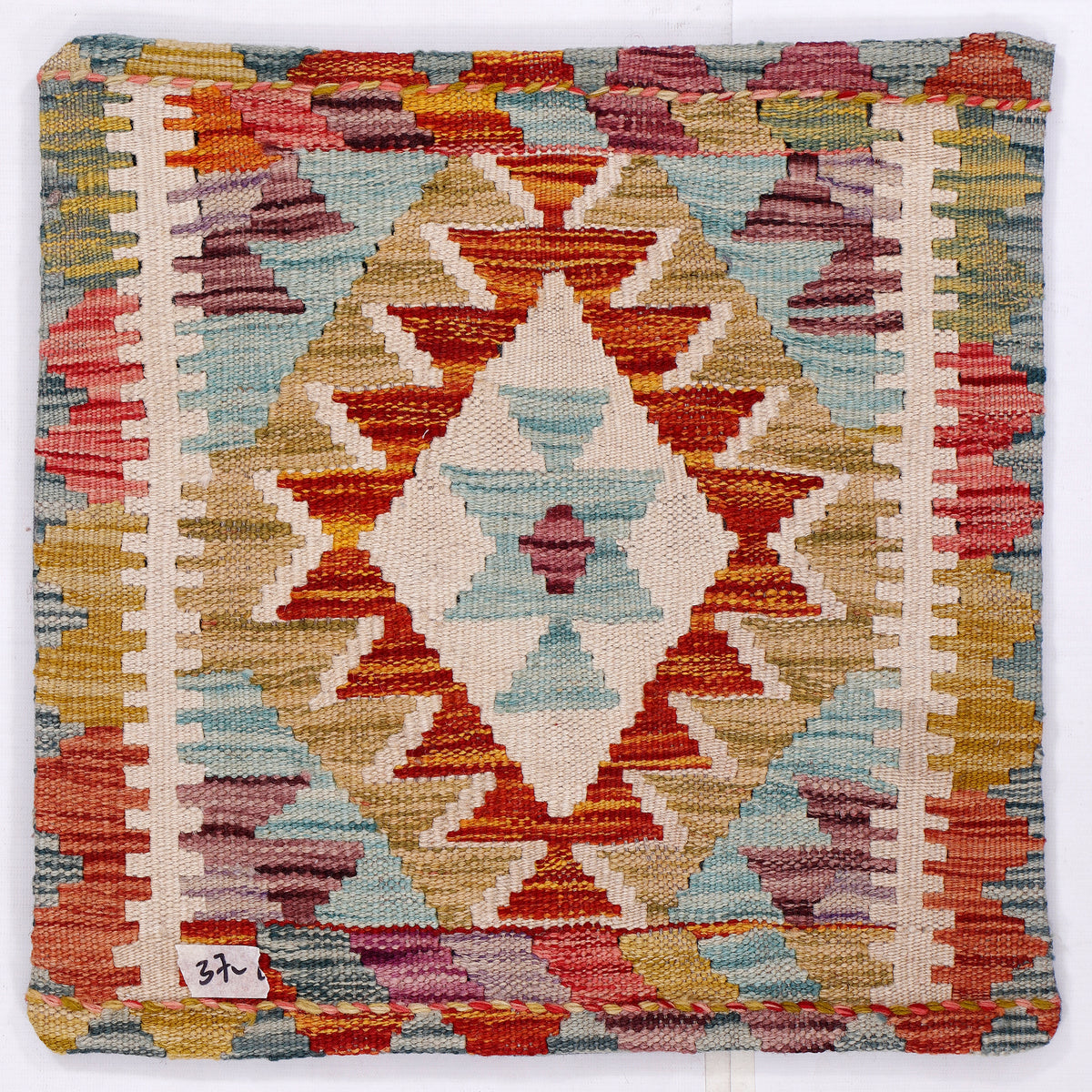 Kilim cushion front with close geometric diamond pattern in red, blue, gold, cream