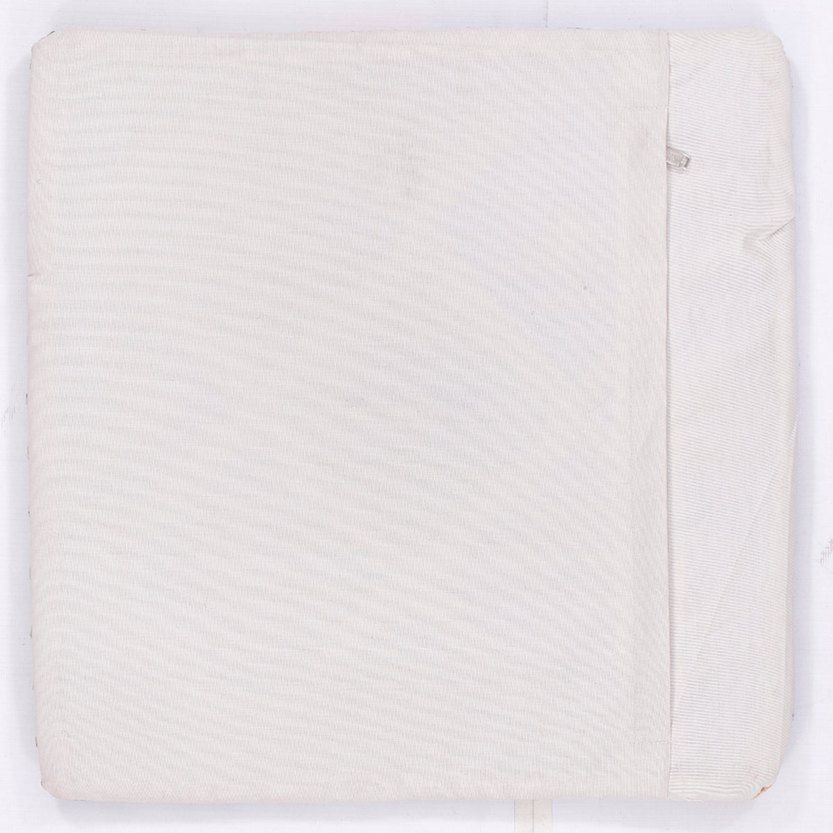 Kilim cushion cover back in solid white fabric with subtle side seam