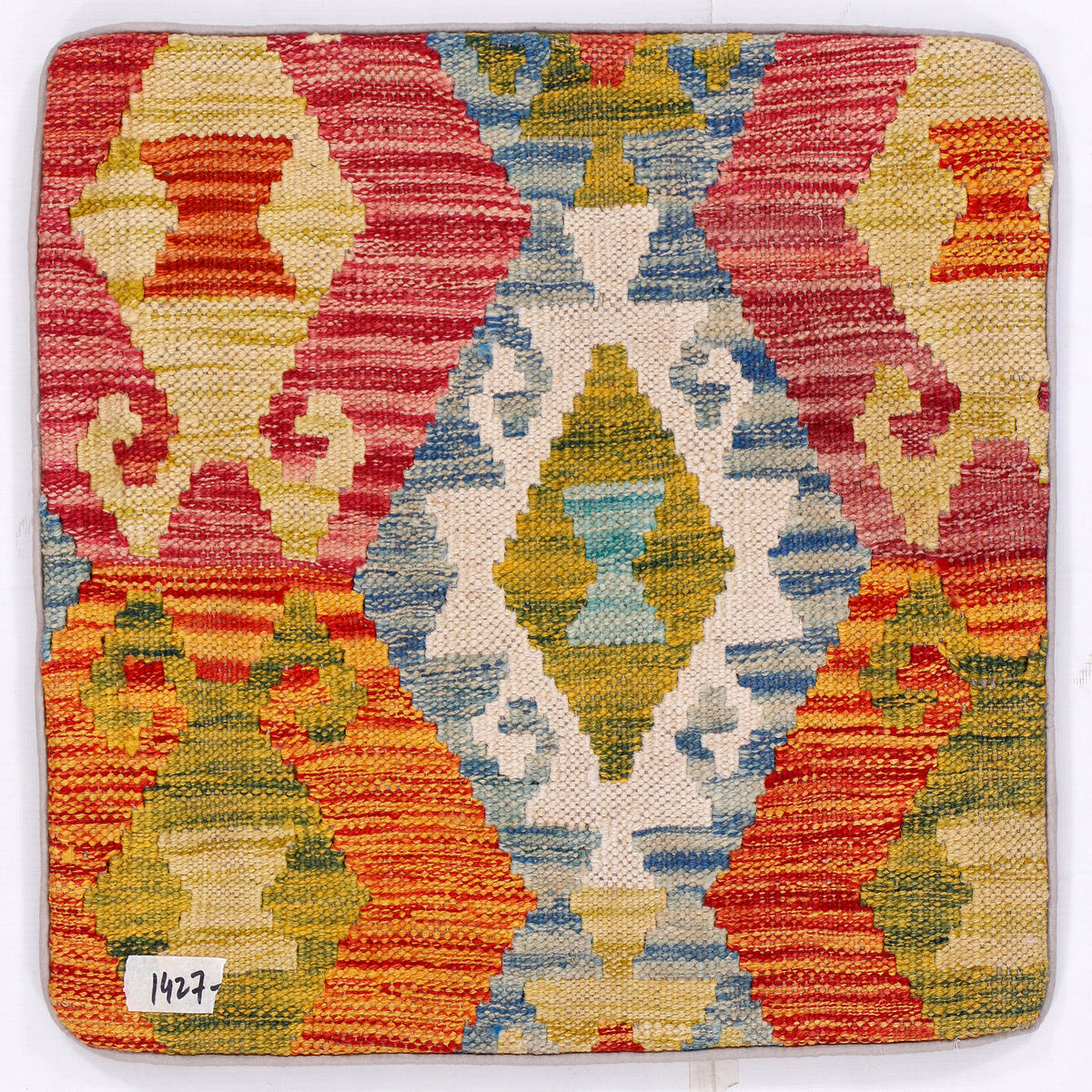 Kilim cushion cover close-up with red, blue, and yellow medallion motif, 45x45 cm