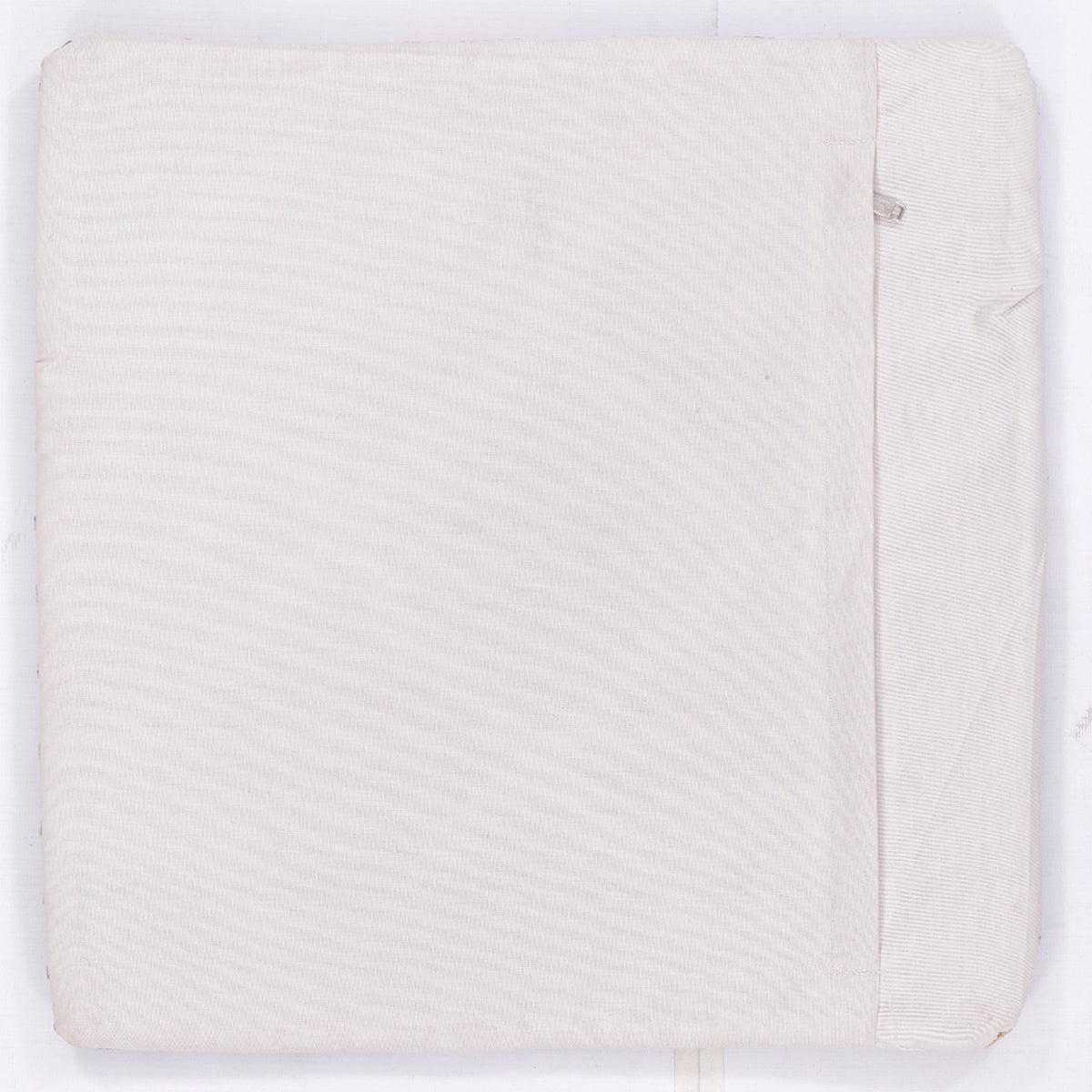 Kilim cushion back in off-white textured fabric with side seam detail