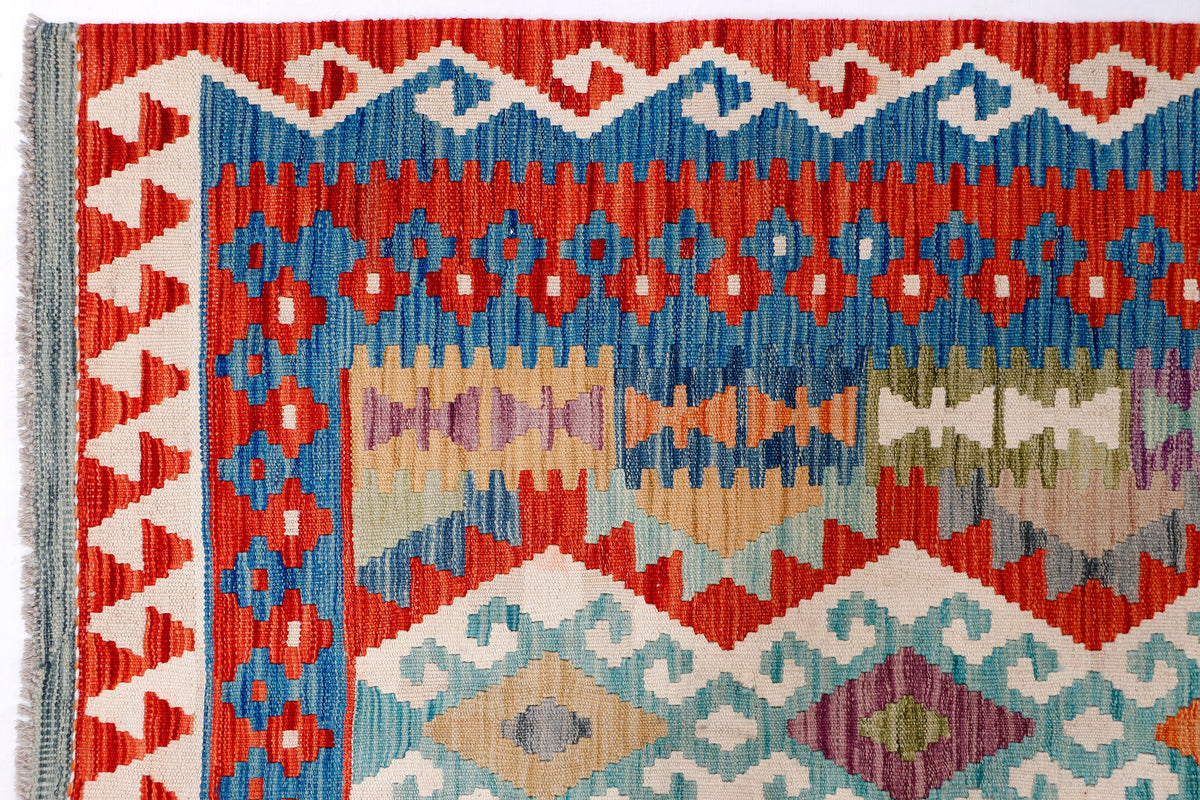 Kilim rug section with red border and blue, green, and purple geometric bands