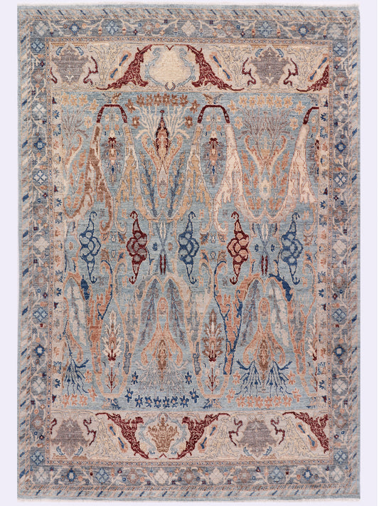 Khyber Oushak rug, symmetric light blue design with dark blue and terracotta motifs