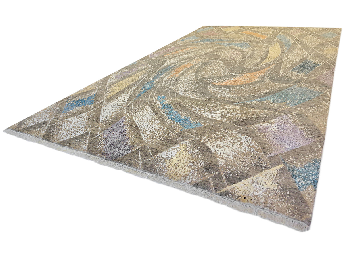 Modern abstract rug corner view with beige-gray base, blue highlights, and curved swirls