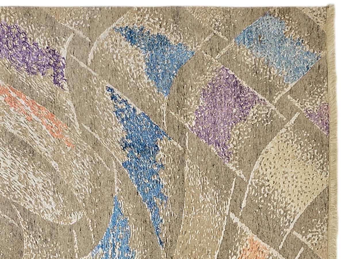 Modern abstract rug close-up with textured beige background, blue stripe, and purple shapes