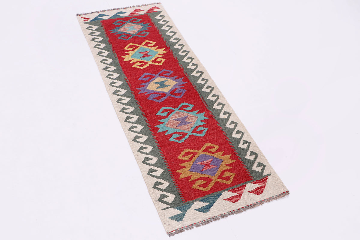 Rectangular kilim rug with red, blue and beige geometric pattern and short fringe