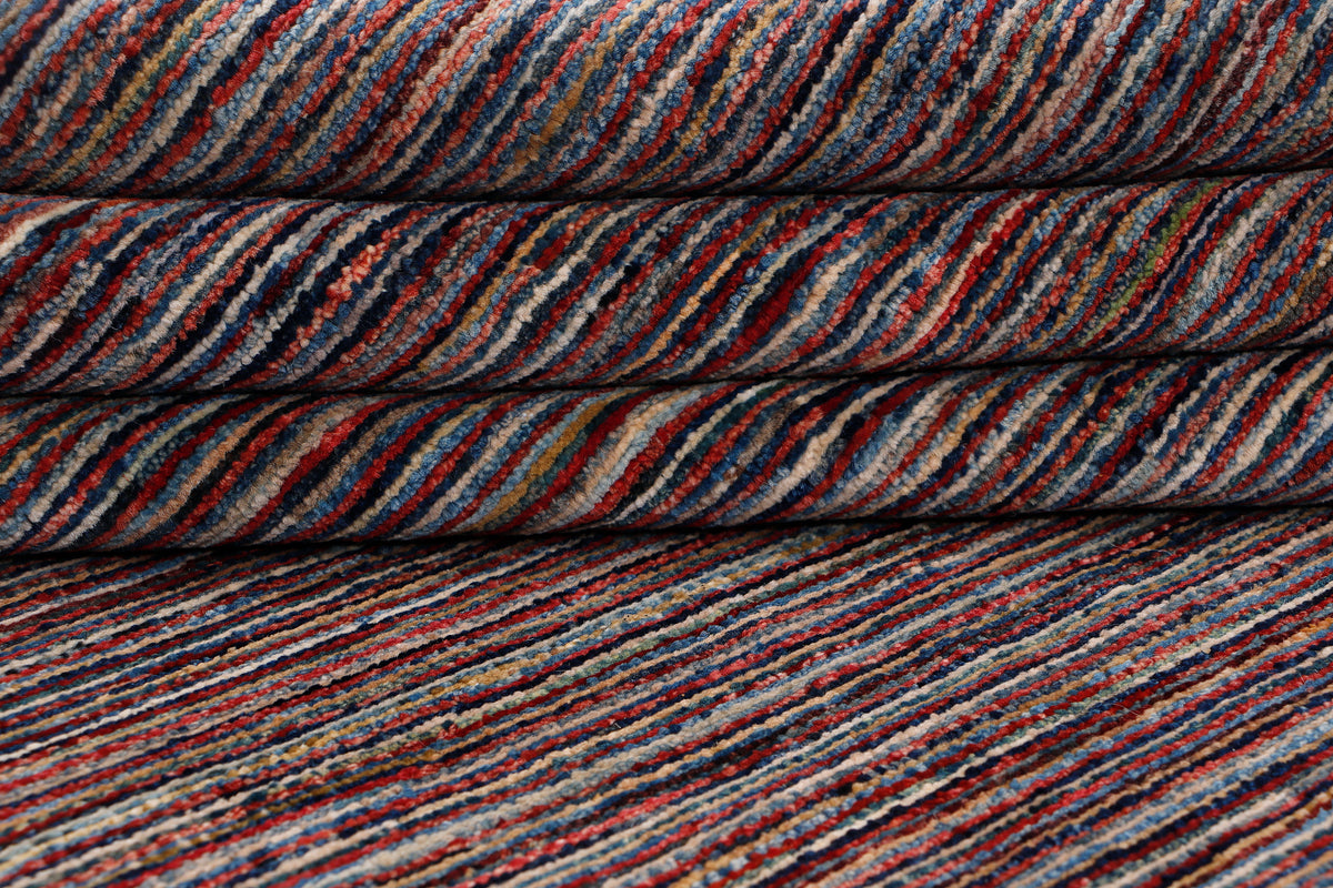 Striped area rug showing stacked look, dark brown with thin multicolor horizontal lines