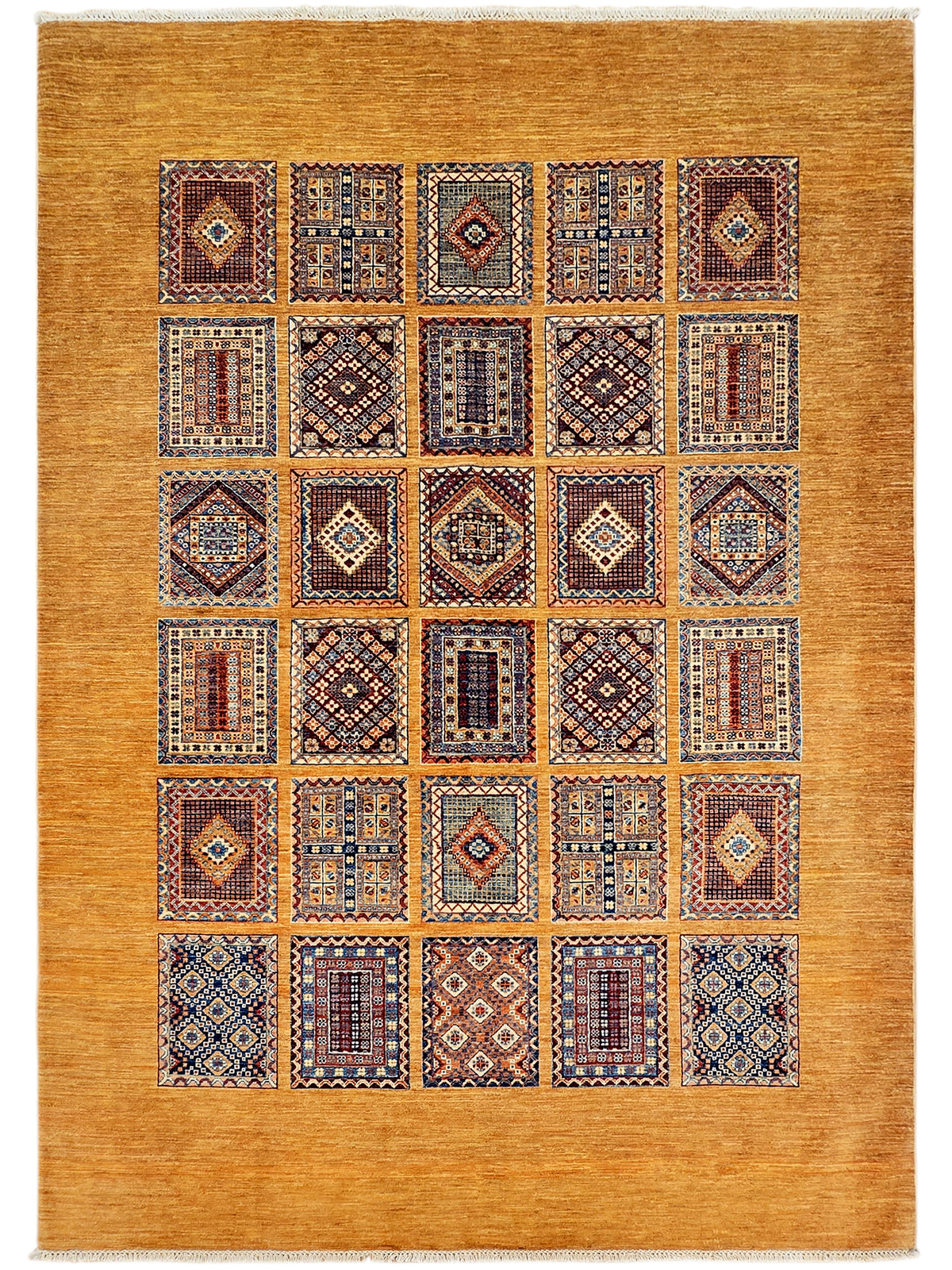 Rectangular area rug with warm gold field and a grid of multicolor geometric medallion blocks