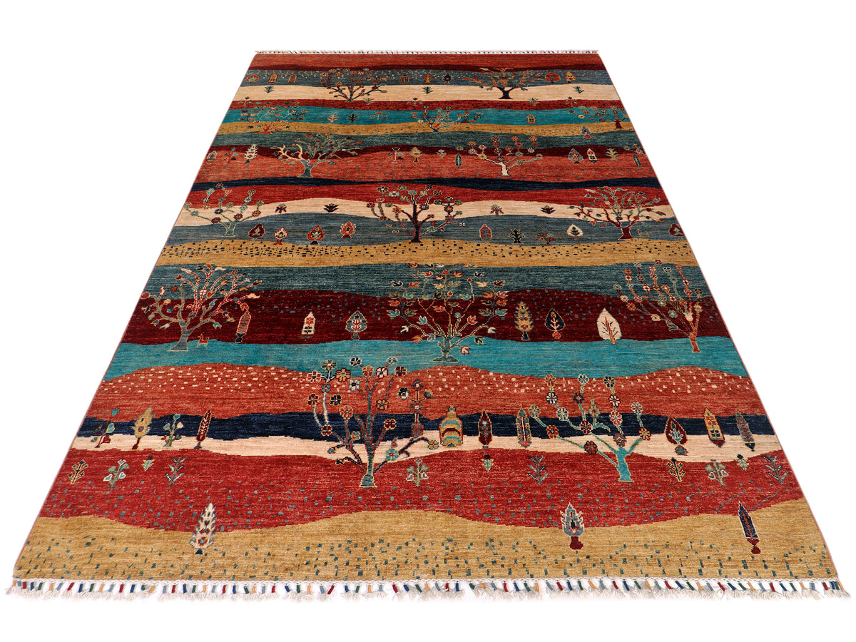 Ariana Gabbeh rug with multicolor stripes, tree scenes, and short fringe trim.