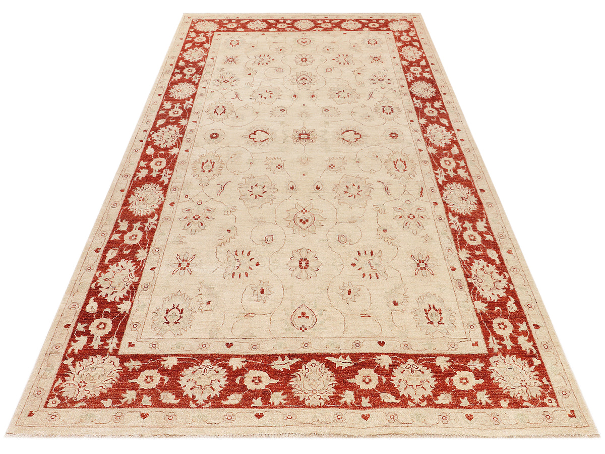 Ziegler Afghan rug laid flat, cream and red with central medallion design