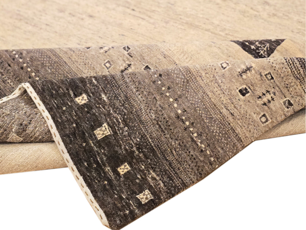 Rectangular rug with beige and dark brown geometric motifs and border trim