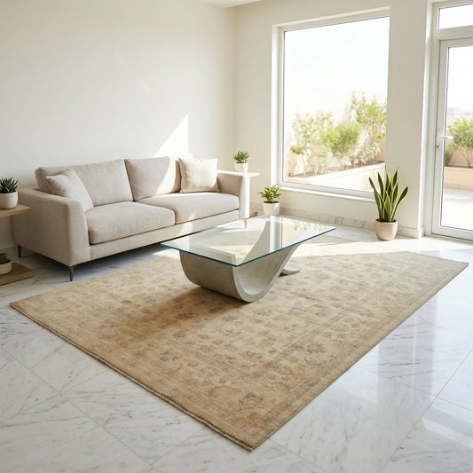 Beige rectangular rug with faded abstract pattern, fringed corners