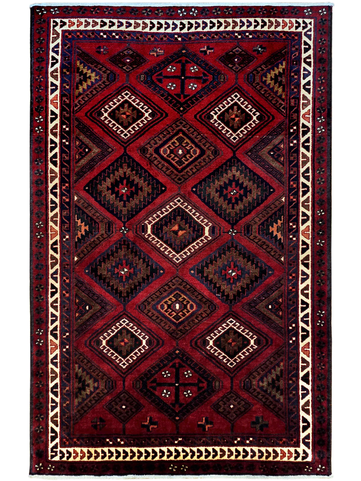 Rectangular red and navy geometric rug with cream diamond motifs and border