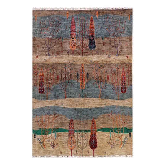 Ariana Gabbeh rug with blue, tan, and rust geometric tree pattern