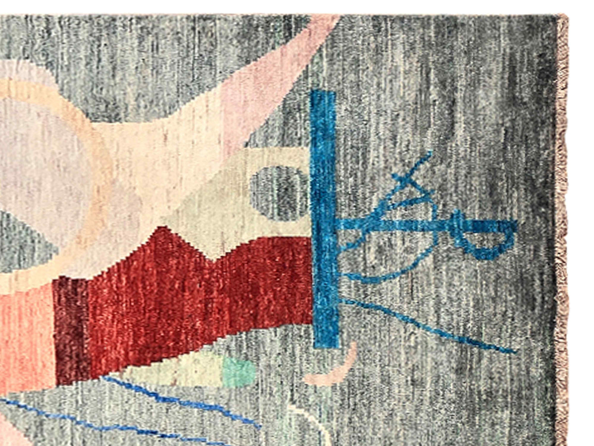 Abstract area rug with geometric blocks and scribble lines on a gray background
