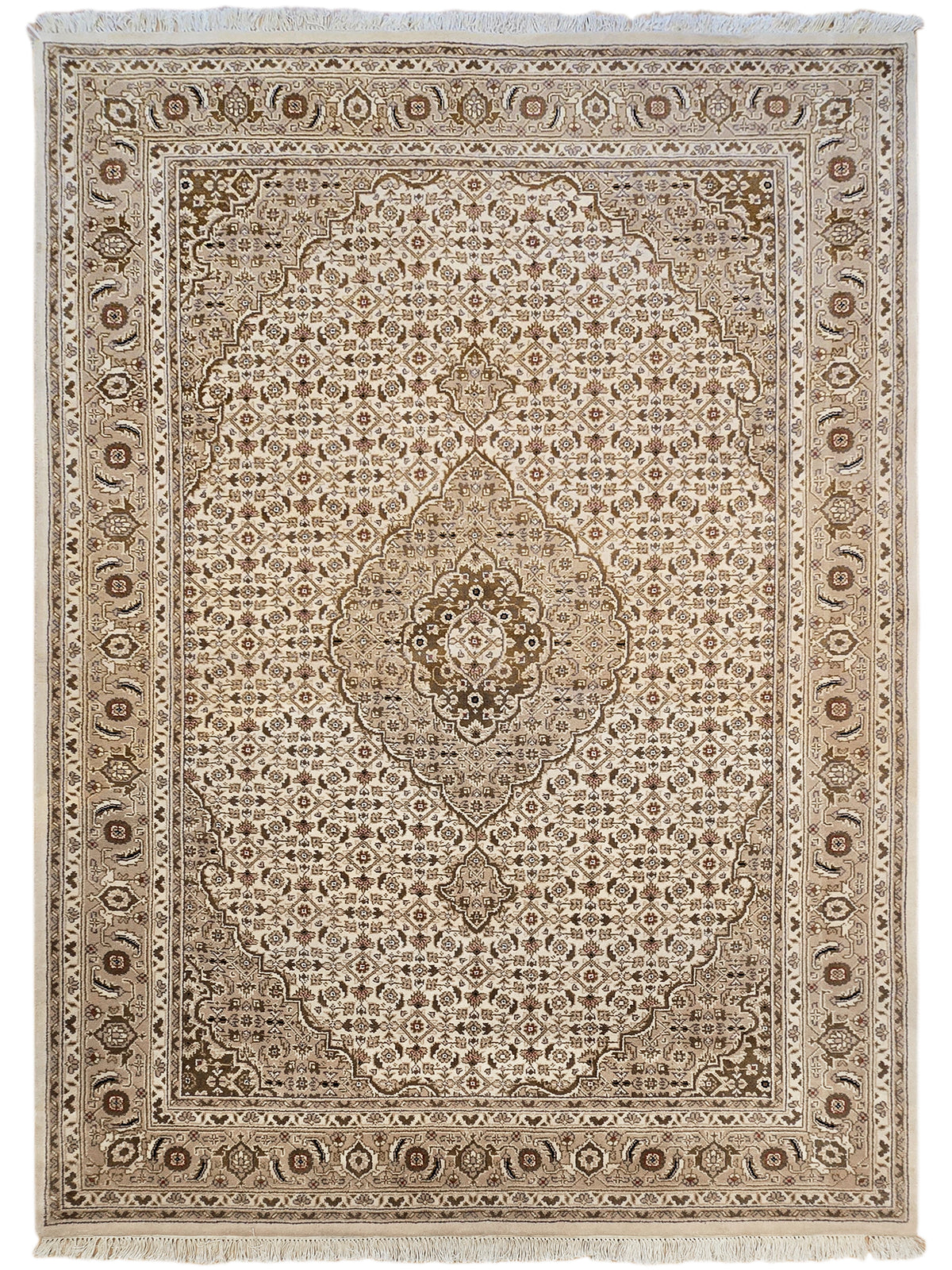 Square beige and brown patterned rug with central medallion and geometric border.